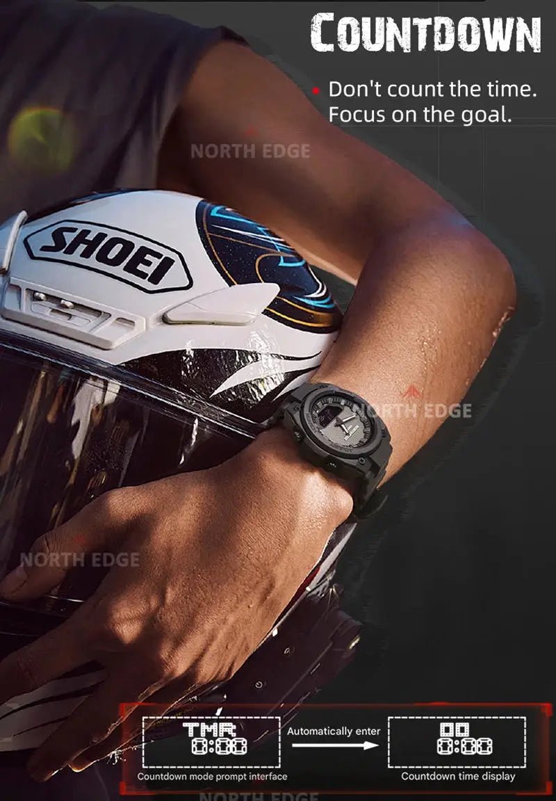 North Edge Fortress 2026 men's digital sport watch, black rugged LED wristwatch worn on the wrist beside a Shoei helmet