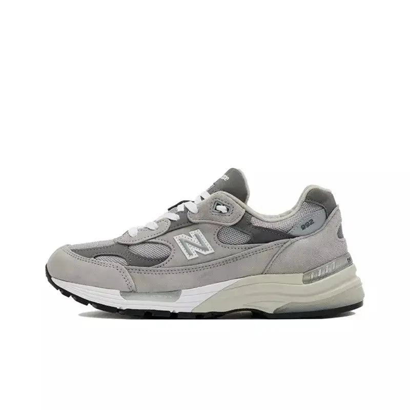 Unisex gray mesh running shoe with white N logo, retro-style casual sneaker with cushioned sole