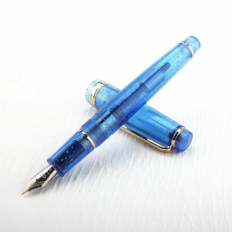 Jinhao 82 fountain pen in blue acrylic with gold trim; two pens crossed, nib visible