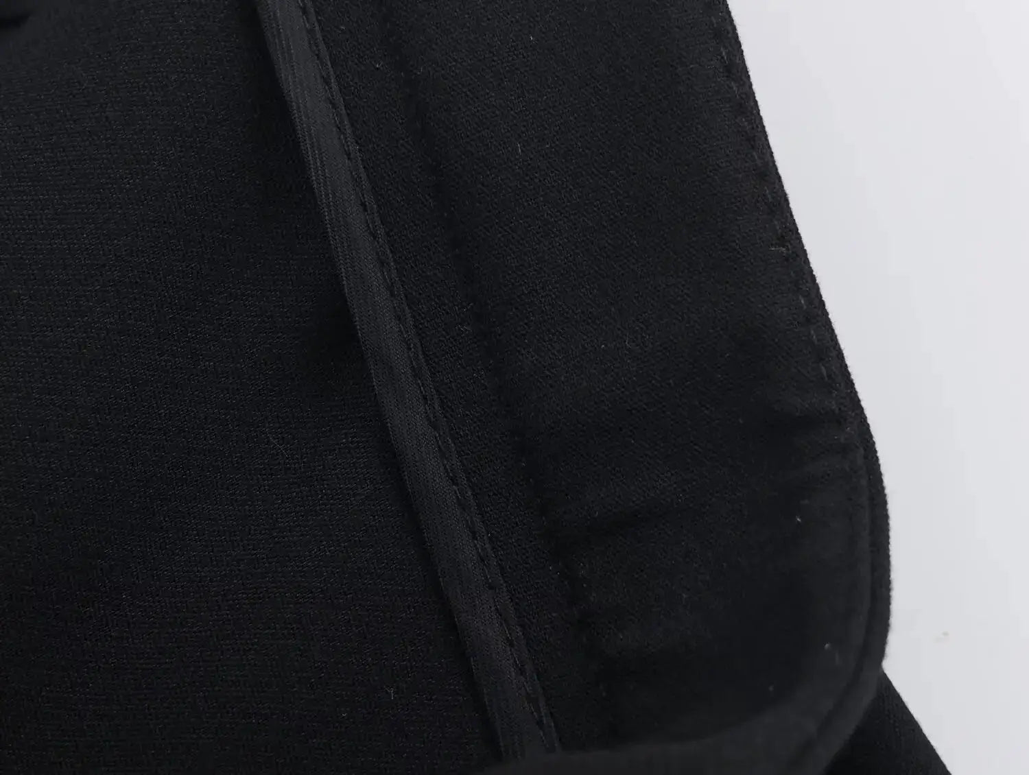 Women's black blazer jacket with textured fabric; part of a two-piece suit set