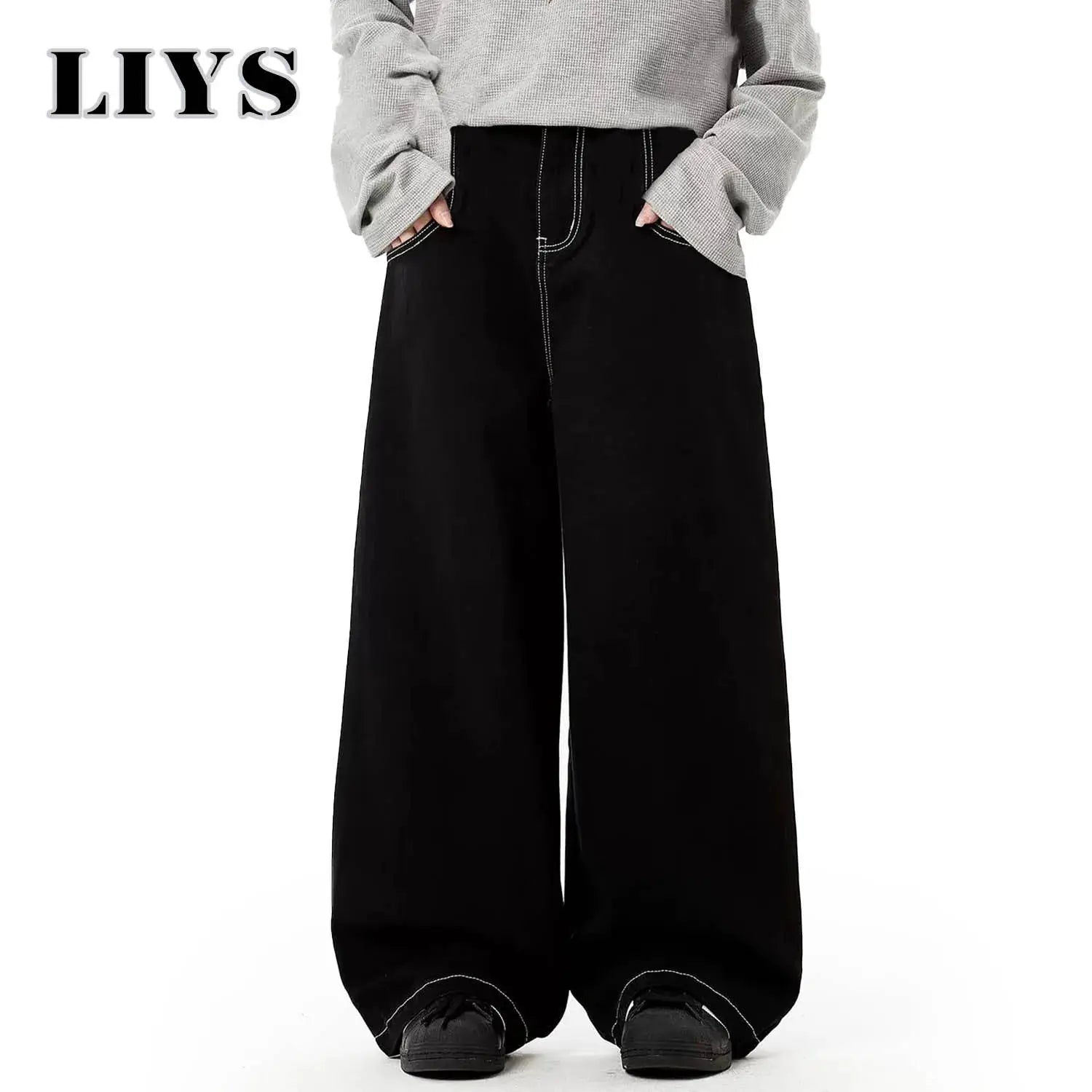 Baggy black wide-leg denim jeans with white contrast stitching and oversized fit, casual unisex pants