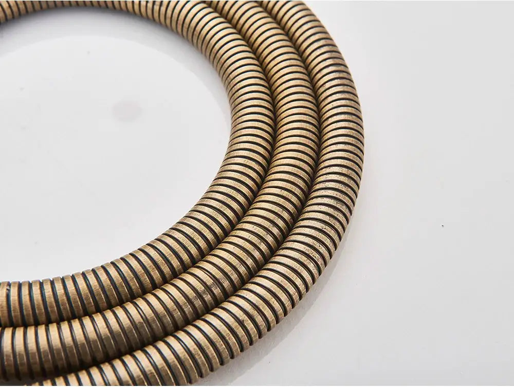 Antique brass shower hose, 150cm, flexible coiled metal.