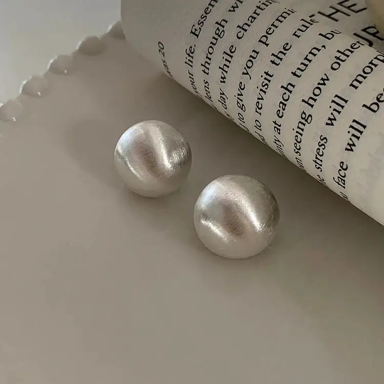Brushed frosted silver round stud earrings, domed metal finish, pair
