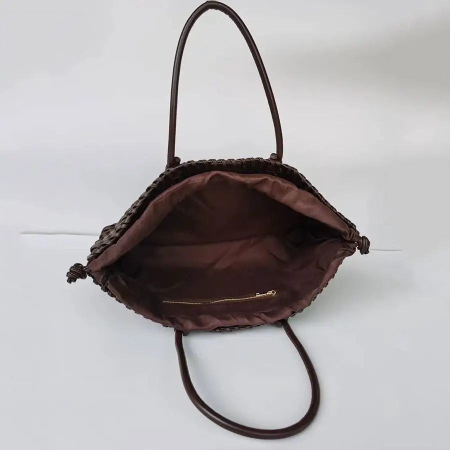 Woven shoulder tote bag with two hand-held handles; brown lining and interior zipper pocket, roomy capacity