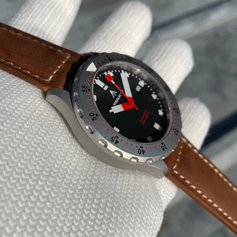 STEELFLIER SF752 automatic wristwatch with gray case, brown leather strap, black dial and red accents
