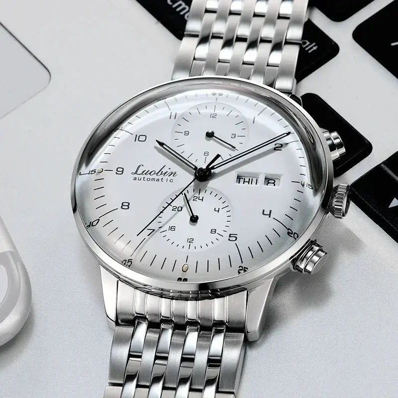 Men's stainless steel automatic wristwatch with white dial, three subdials and day/date window by Luobin.