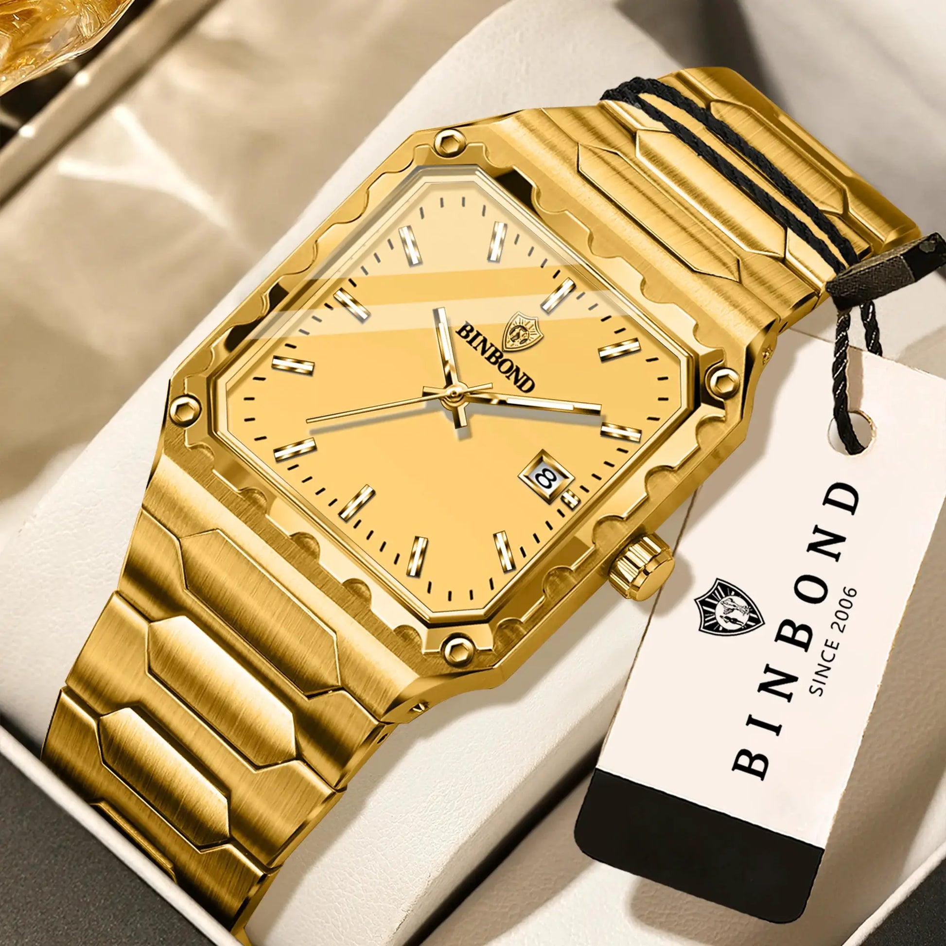 Gold-tone BINBOND men's quartz wristwatch with square face, date window, and metal bracelet
