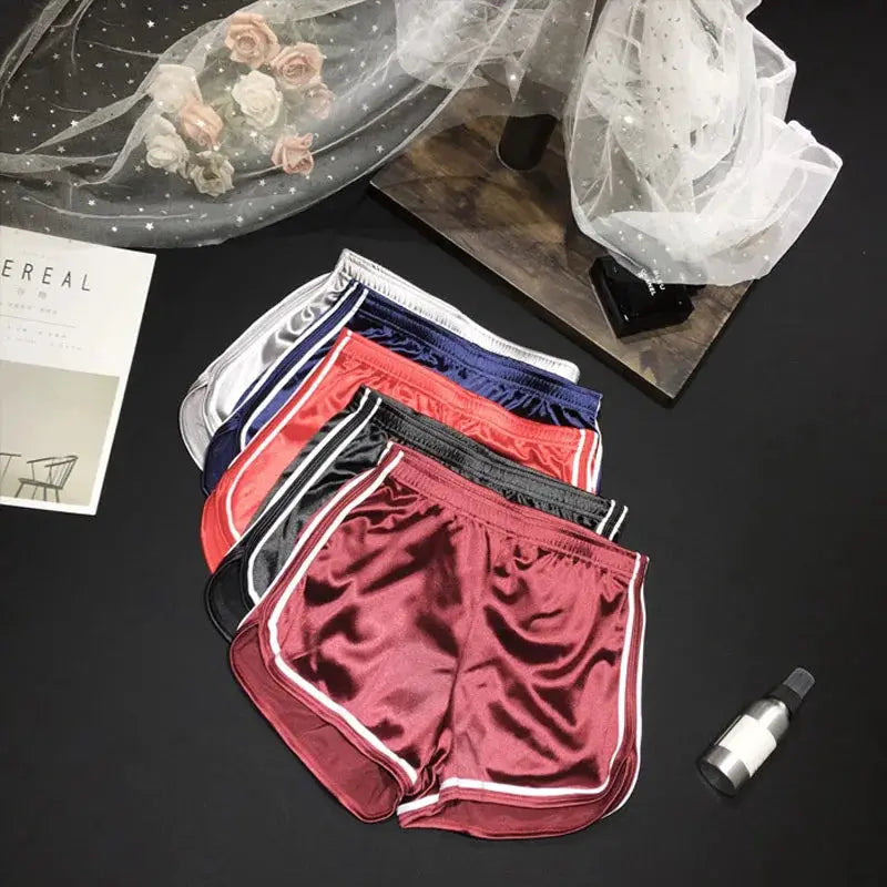 Women's silk shorts, six pairs in white, navy, royal blue, red, burgundy, black with white piping.
