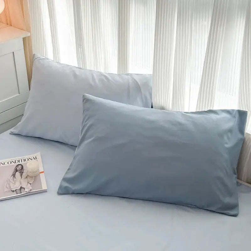 Simples Market 4-piece light-blue brush-fabric bedding set with duvet cover and matching pillowcases on a bed