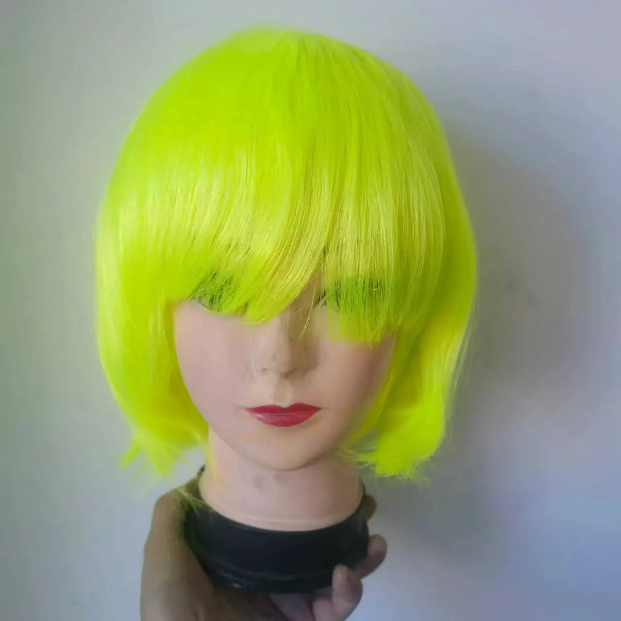 Bob wig neon lime yellow synthetic short bob on mannequin head for cosplay and daily wear