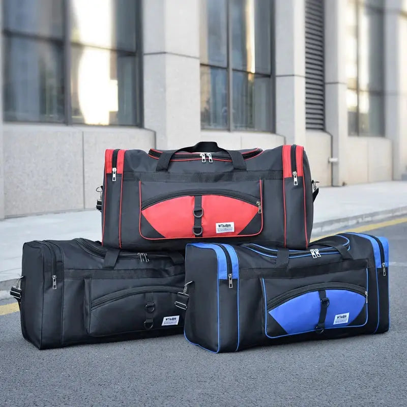 Three Simples Market oversized duffle bags with red and blue accents for travel and gym use