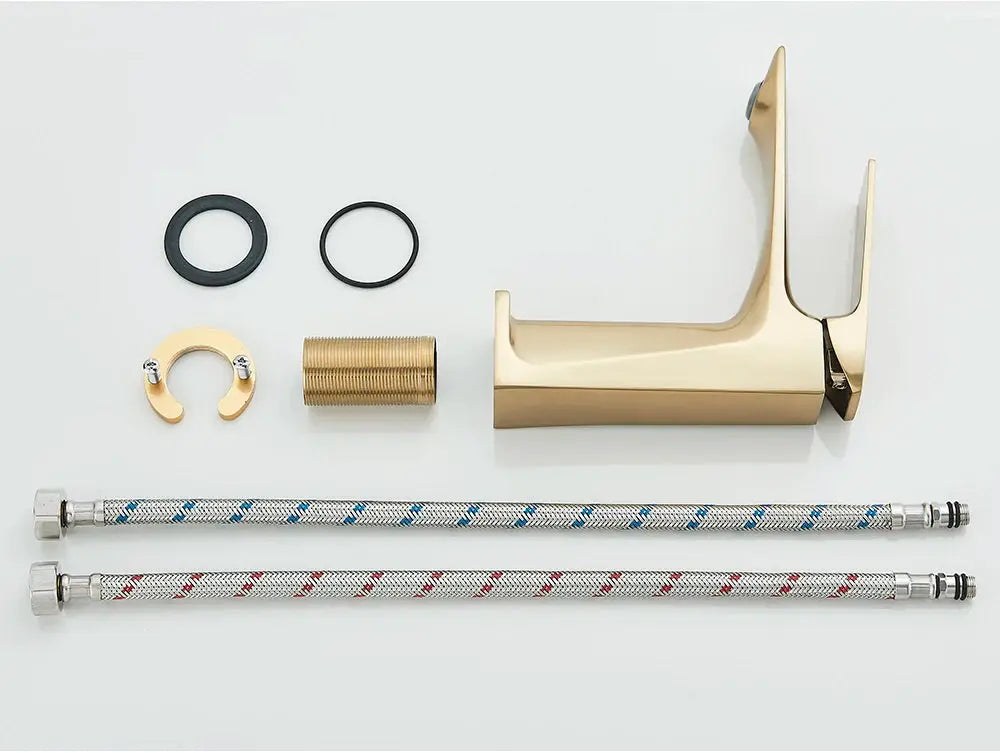 Brushed gold deck-mounted bathroom faucet with two braided blue and red supply hoses and mounting hardware.
