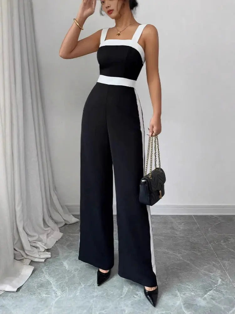 Women's black and white jumpsuit with square neckline and contrast trim; wide-leg evening wear