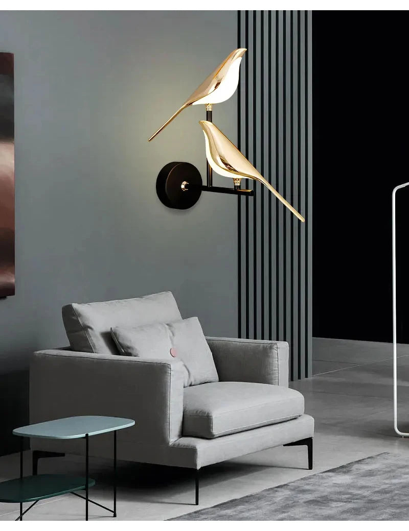 Modern LED wall lamp with two gold magpie bird accents on a black wall mount, decorative indoor sconce.