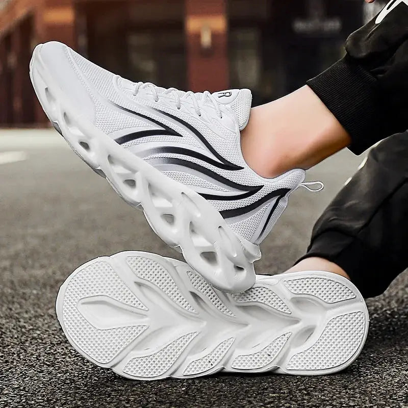 White mesh running shoes by Simples Market, breathable athletic sneakers with black wave accents and chunky sole.