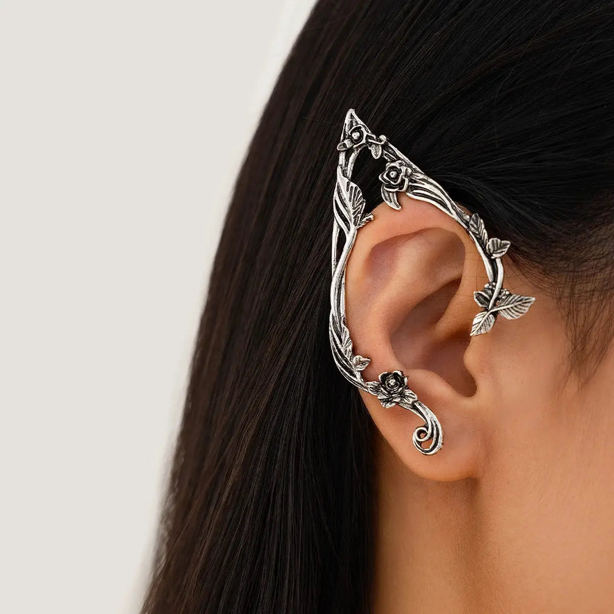 Elf leaf silver ear cuff with floral vine and rose accents, decorative jewelry