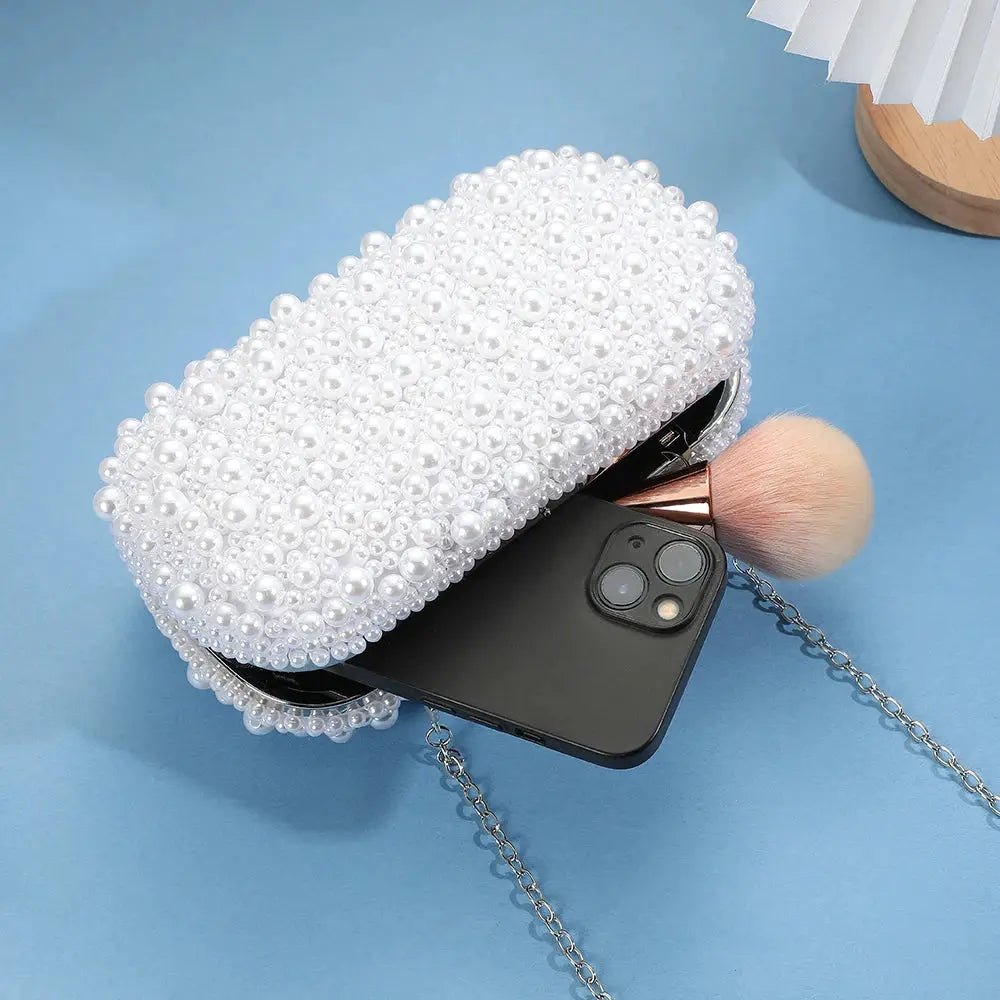 Simples Market pearl-embellished handheld evening bag in white with chain strap