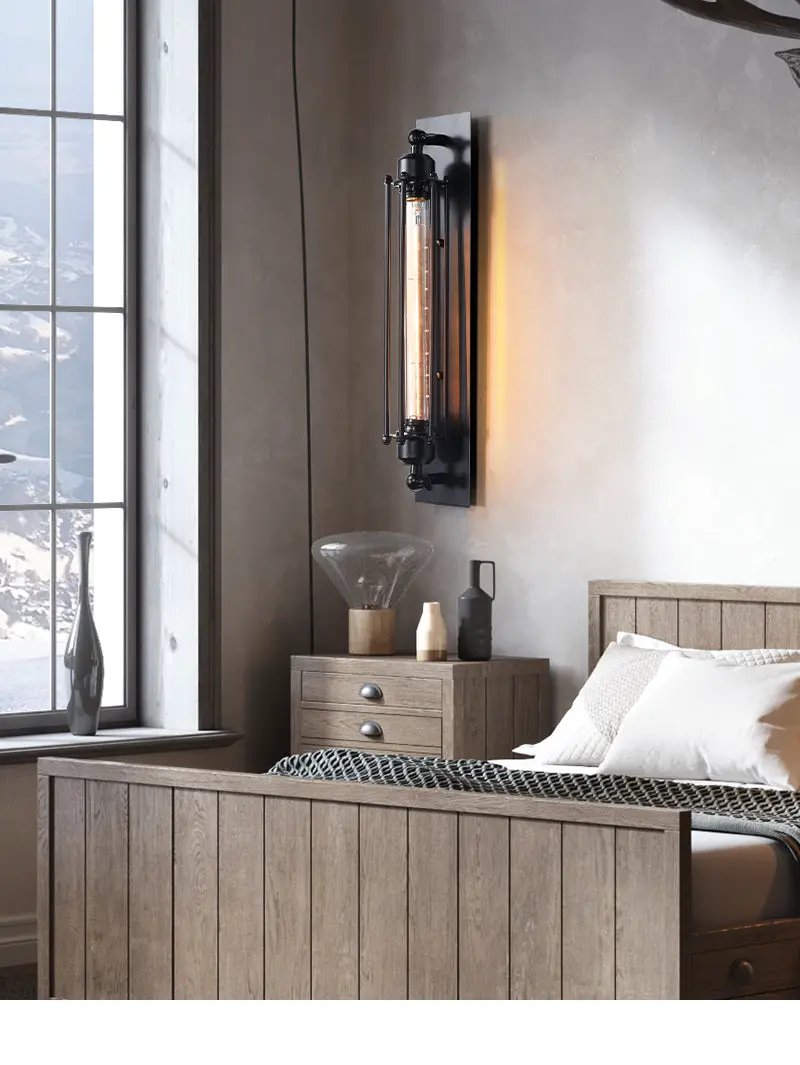 Retro industrial iron wall light with glass tube Edison bulb, black finish, wall-mounted above bedside table
