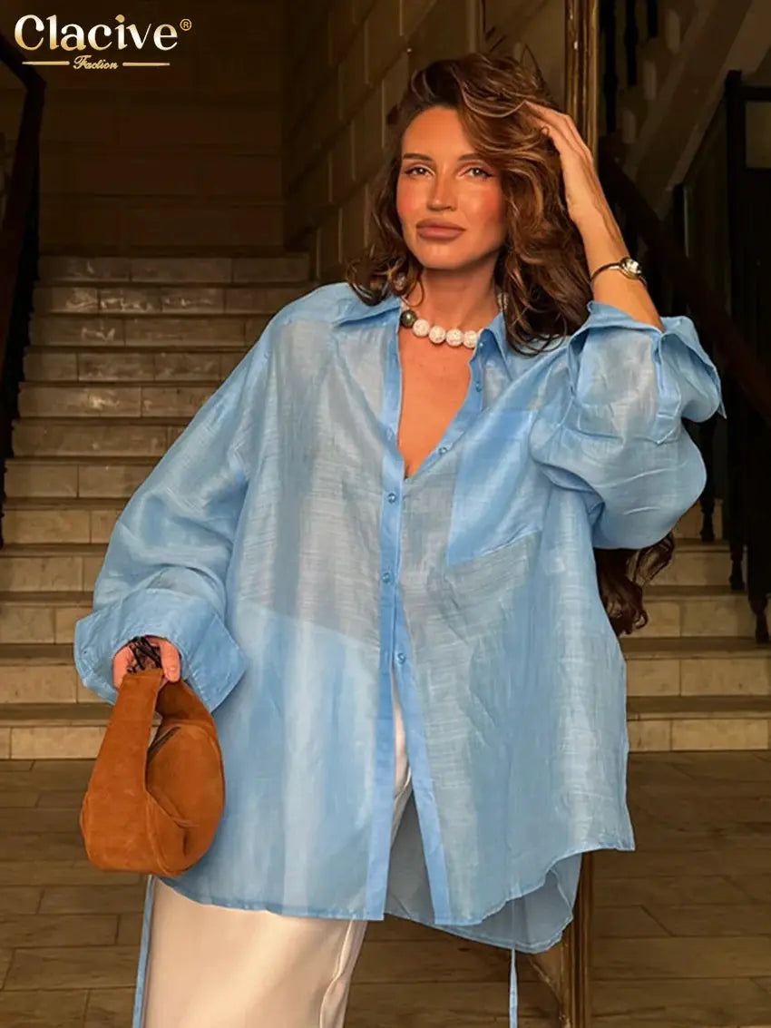 Clacive loose blue women's blouse, oversized long-sleeve collared shirt with buttons.