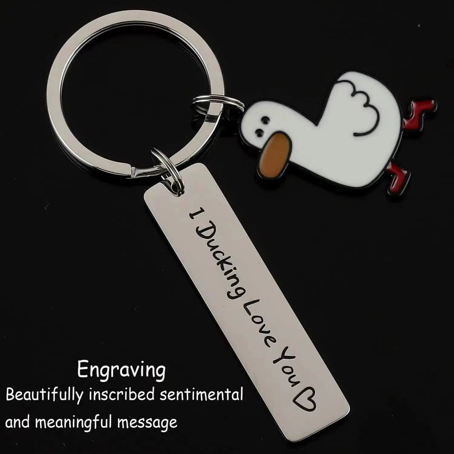 Keychain with a white duck charm, orange beak and red feet on a metal ring; tag reads I Ducking Love You.