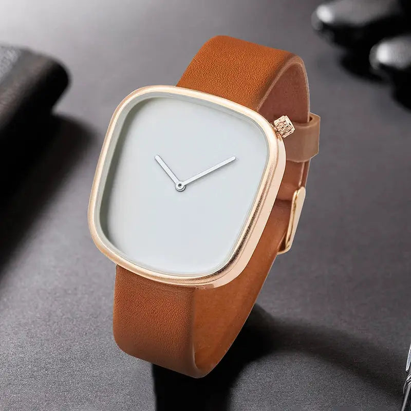 TOMI watch, minimalist square design with brown leather strap, rose-gold case and quartz movement, elegant accessory.