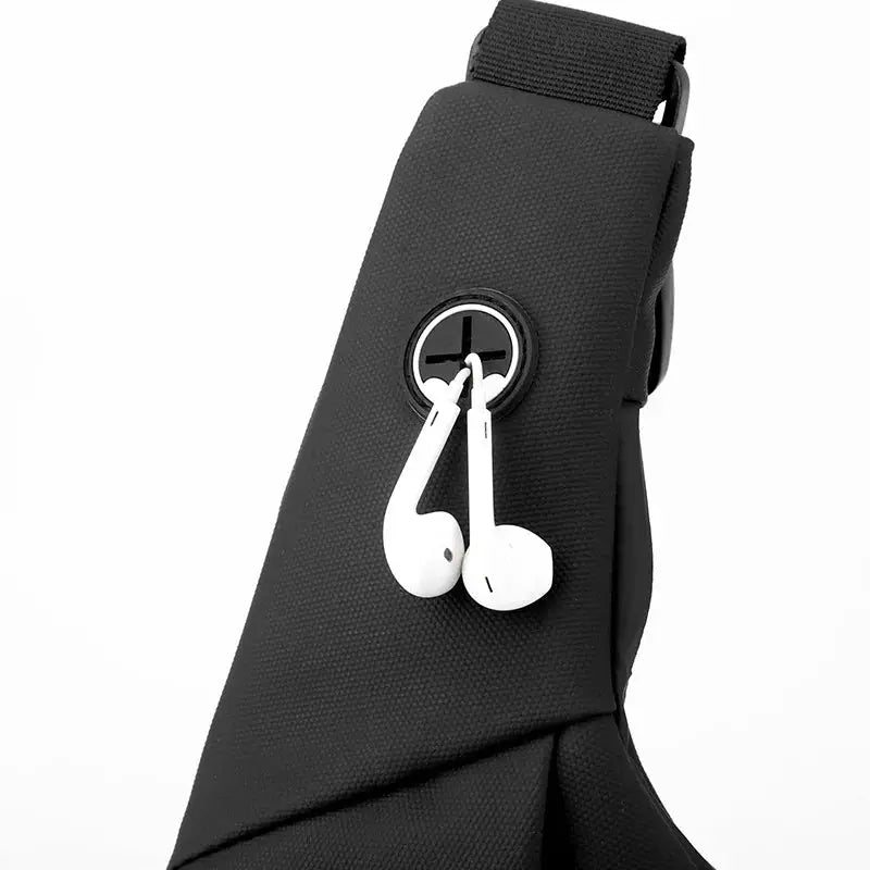 Simples Market black sling bag crossbody with white earphones hanging from a circular logo.