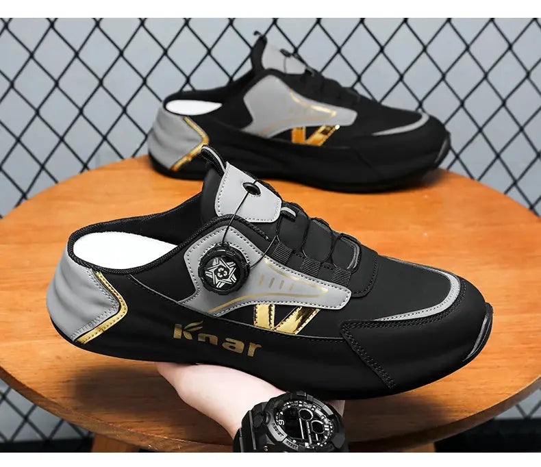 Men's running shoes in black and gray with gold accents; lightweight and breathable, two shoes shown.
