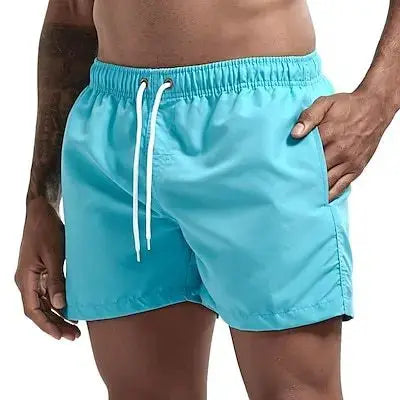 Men's turquoise quick-dry swim trunks by Simples Market with white drawstring and pockets