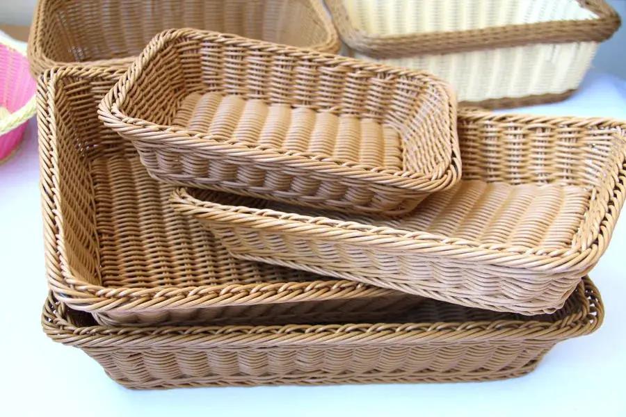 Hand-woven imitation rattan rectangular storage baskets, set of five in natural brown.
