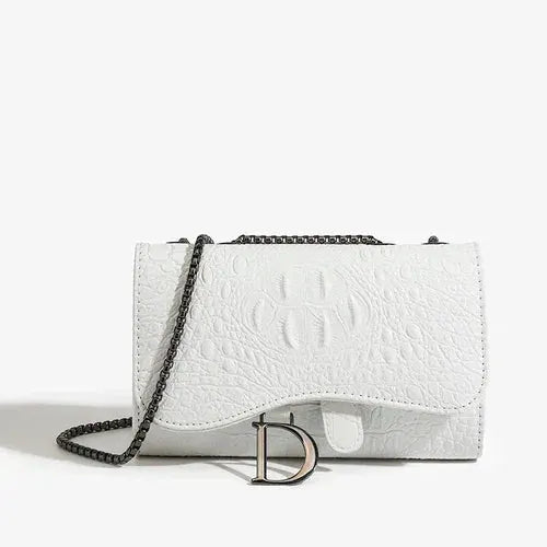 Women's white crossbody handbag with silver chain strap and D charm logo, embossed crocodile texture.