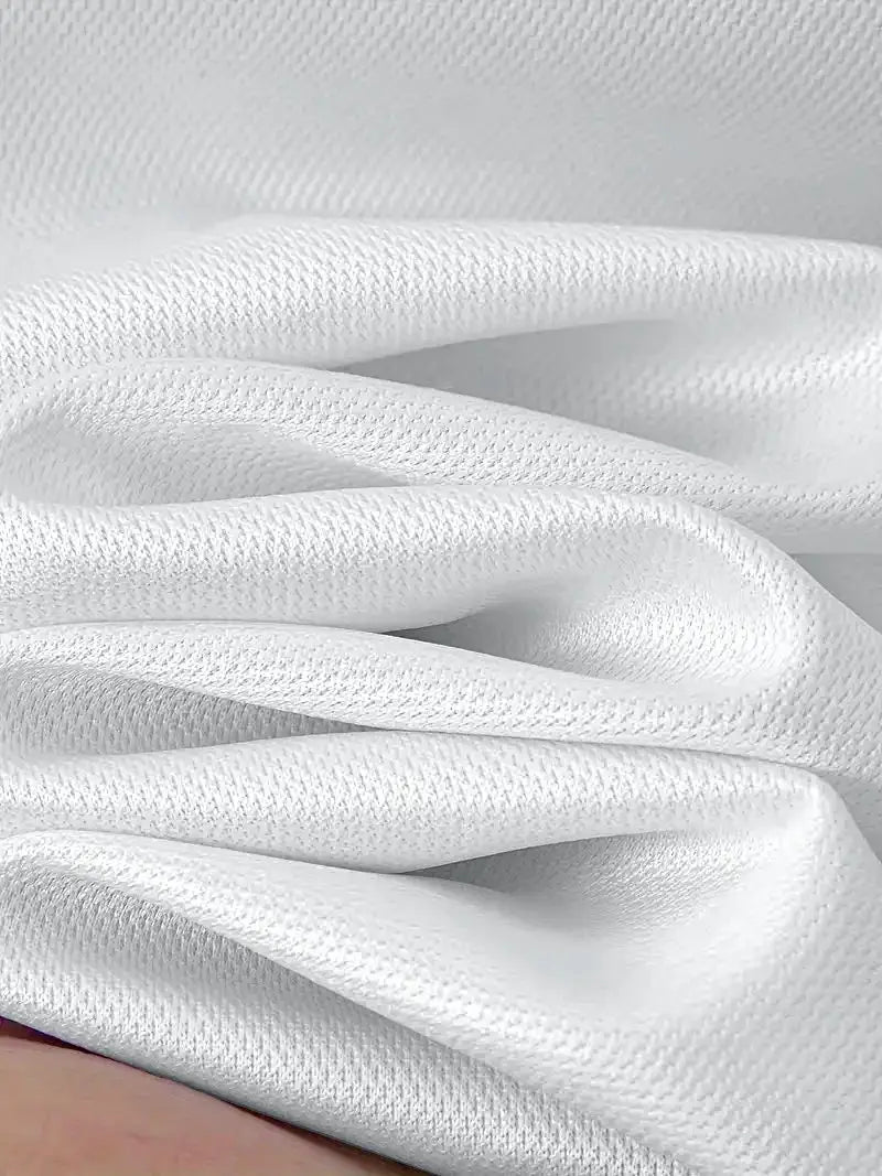 Men's polo shirt in white with breathable textured knit fabric.