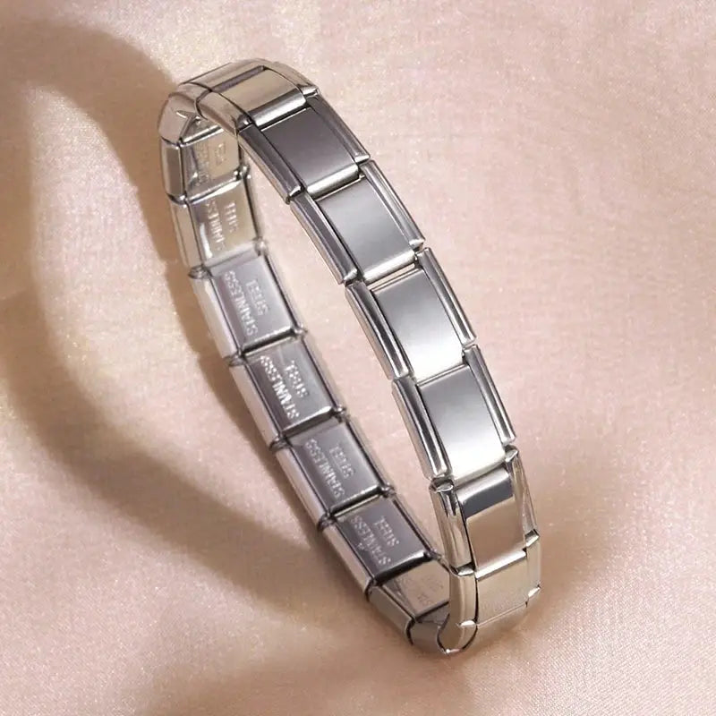 Stainless steel bracelet with rectangular modular links in silver tone.