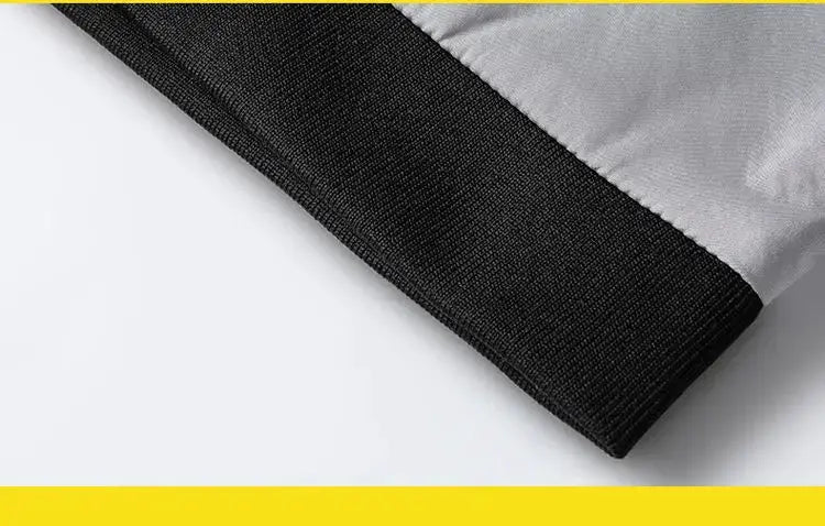 Men's lightweight windbreaker sleeve in gray with black ribbed cuff.