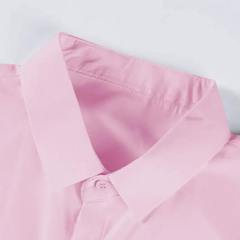 Men's pink solid dress shirt collar close-up with button