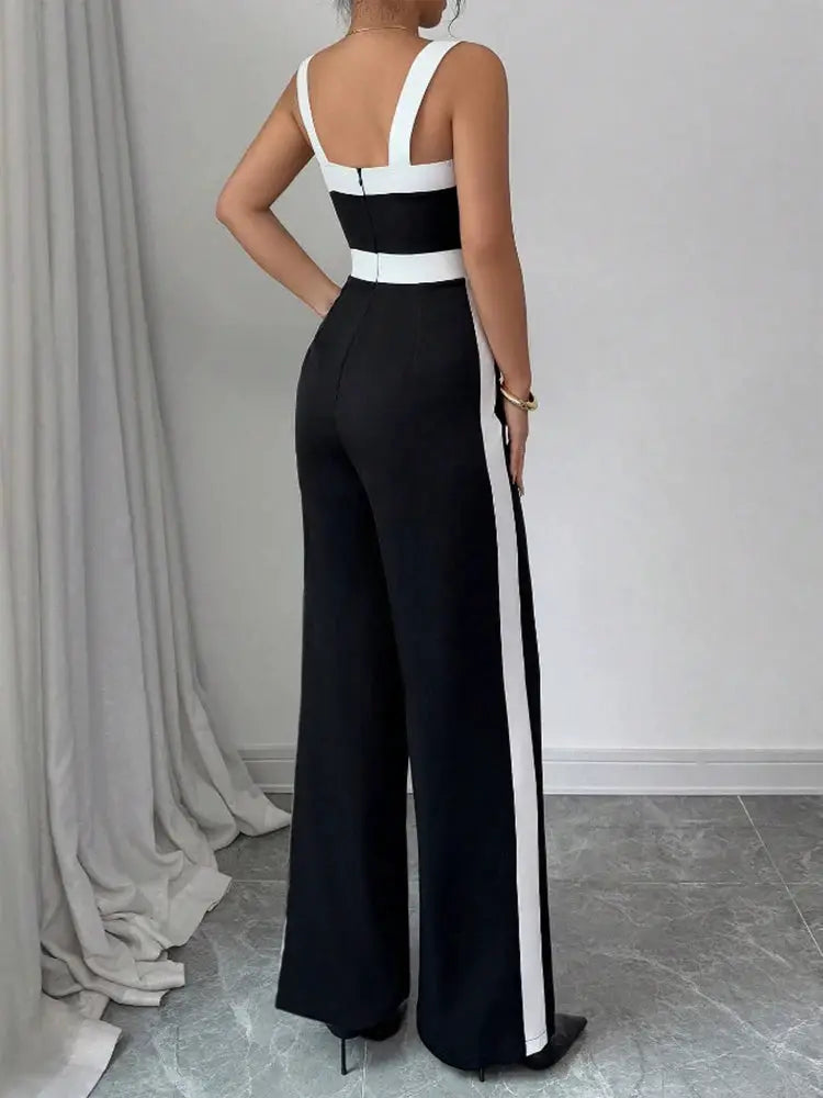 Women's black and white jumpsuit with square neck, contrast trim, and white side stripe; wide-leg silhouette