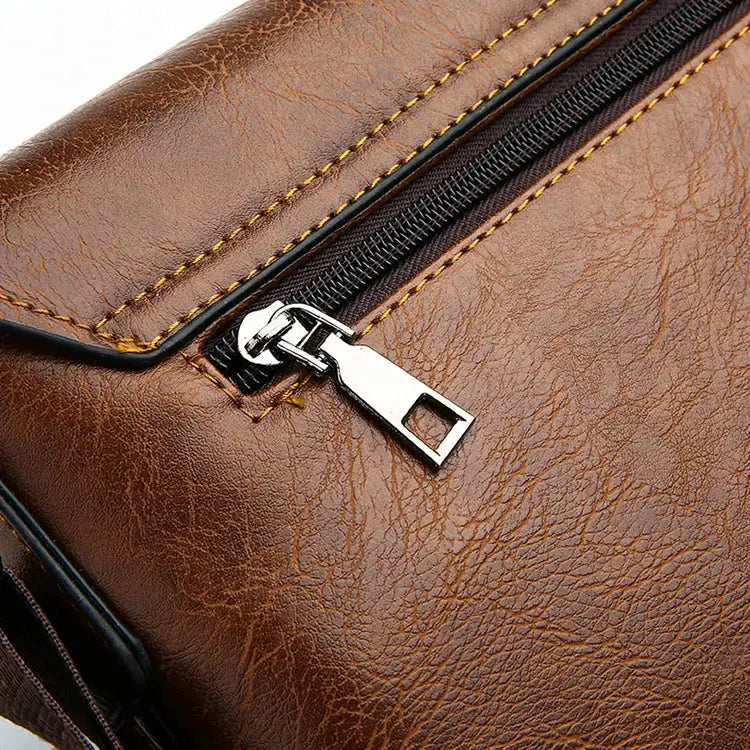 Men's shoulder bag by Simples Market; brown leather with metal zipper pull