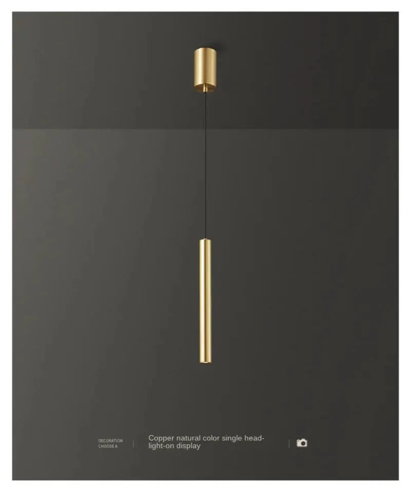 Minimalist bedside pendant lamp by Simples Market, gold with a vertical LED tube.
