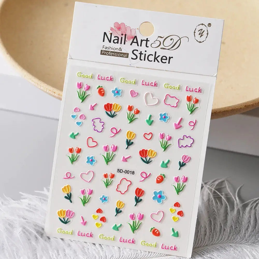 Nail art 5D sticker sheet with colorful flowers, hearts, tulips and Good Luck decals for manicures