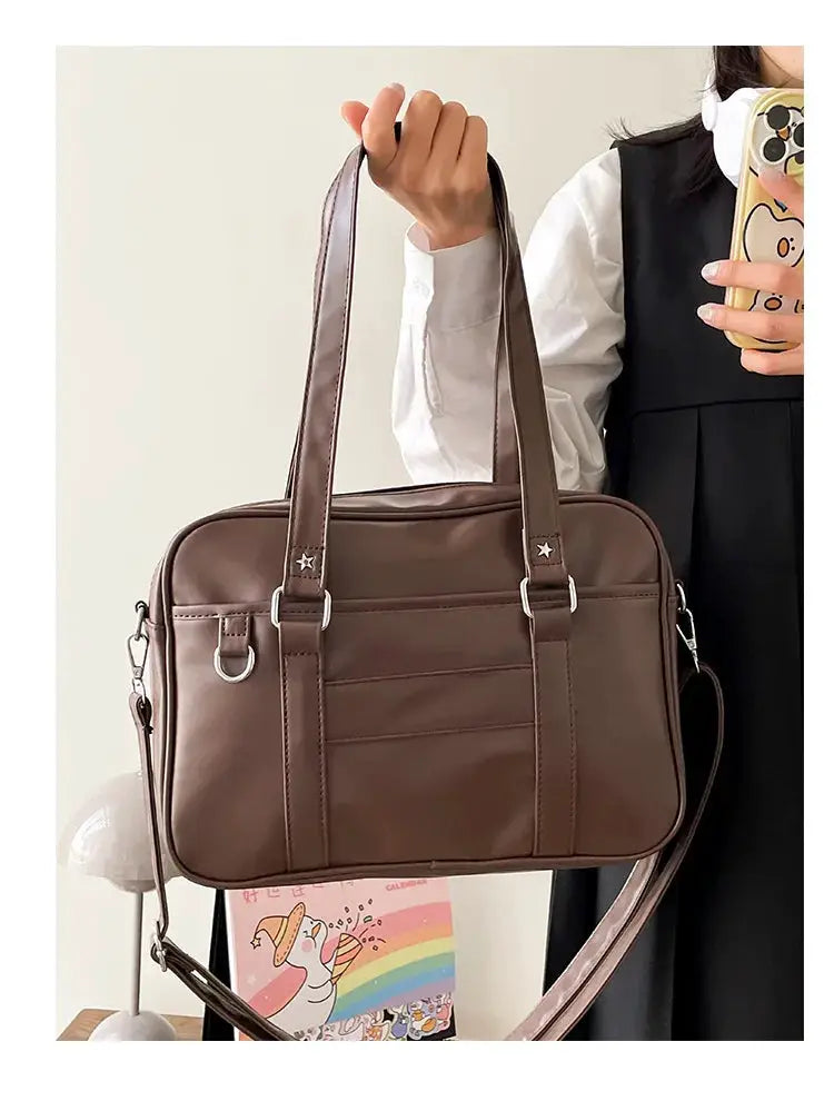 Brown PU leather JK-style handbag with dual top handles and detachable crossbody strap