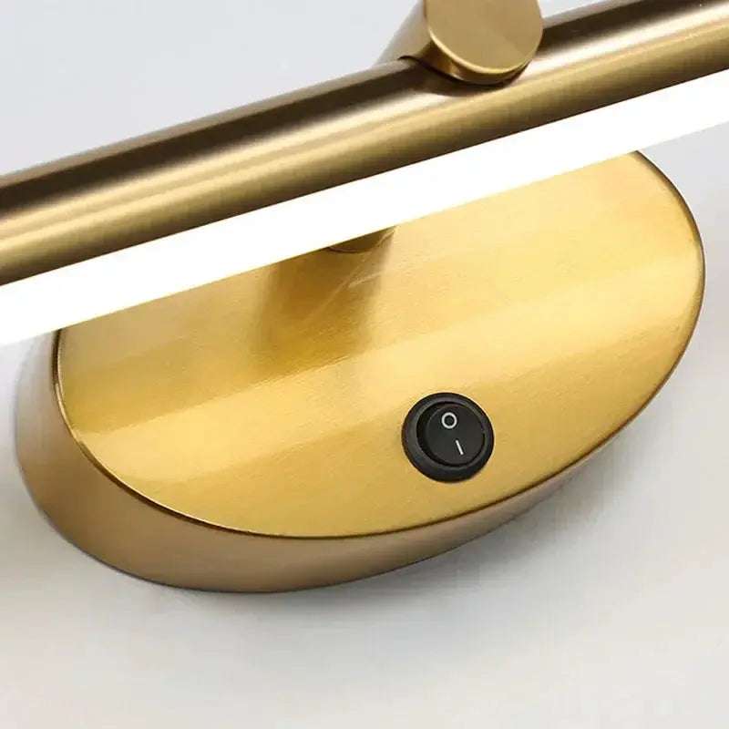 Gold metal LED indoor wall lamp with a horizontal light bar and round touch switch; minimalist bathroom mirror light