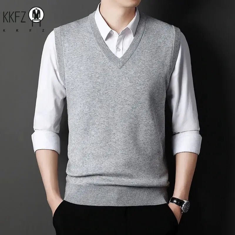 Men's solid gray V-neck knitted vest over a white shirt, KKFZ logo visible