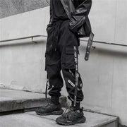 Black cargo jogger pants for men with ribbon strap details, streetwear techwear inspired