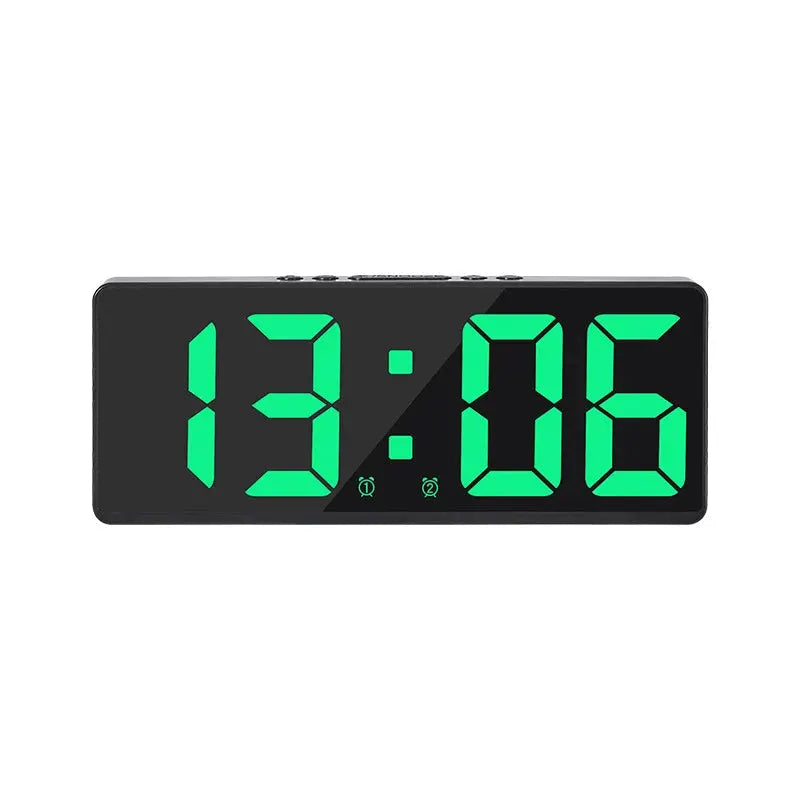 Acrylic/mirror digital alarm clock in black with large green LED digits.