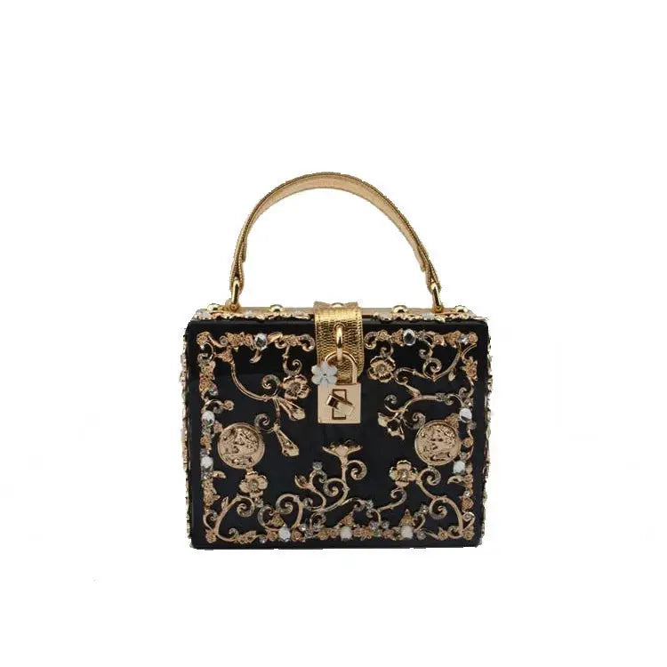 Evening handbag by Simples Market, black with gold floral filigree and crystal accents, top handle