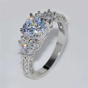 Silver engagement ring with a large central zircon and pavé side stones