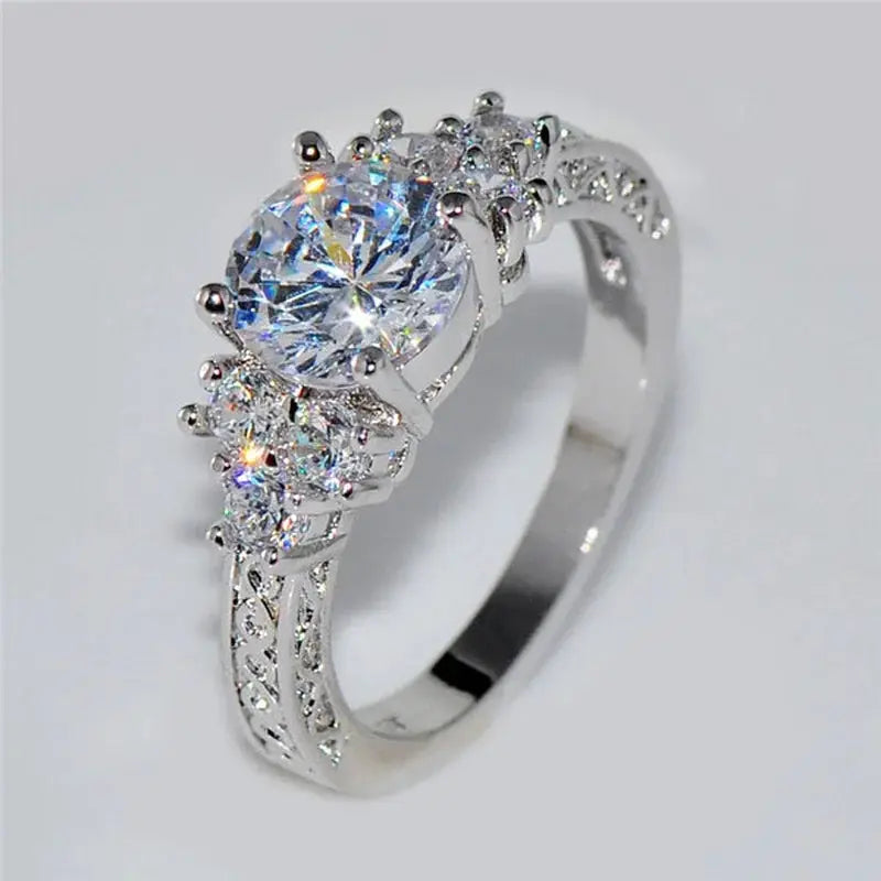 Silver engagement ring with a large central zircon and pavé side stones
