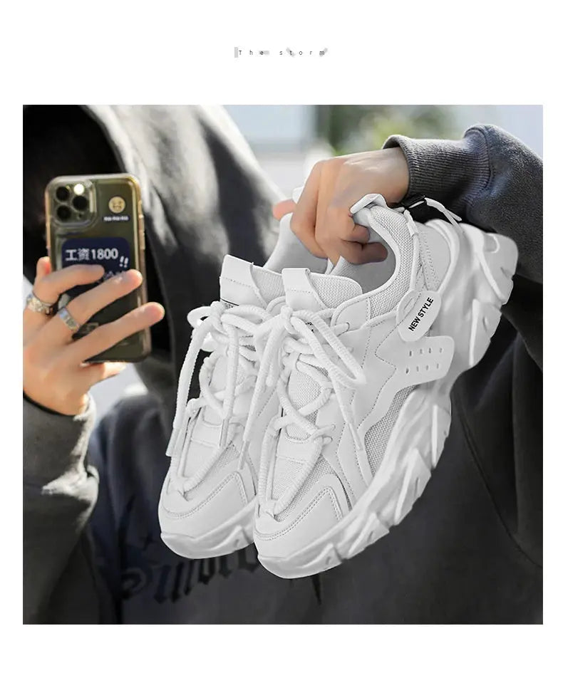 White men's sneakers with thick, breathable soles; pair shown for casual outdoor running