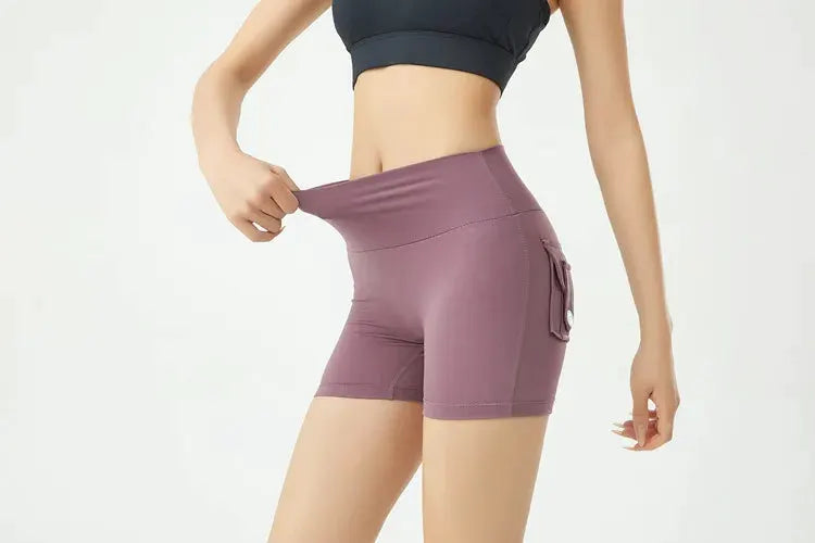 Simples Market peach-pink fitness shorts with side cargo pocket, air-dry fabric.