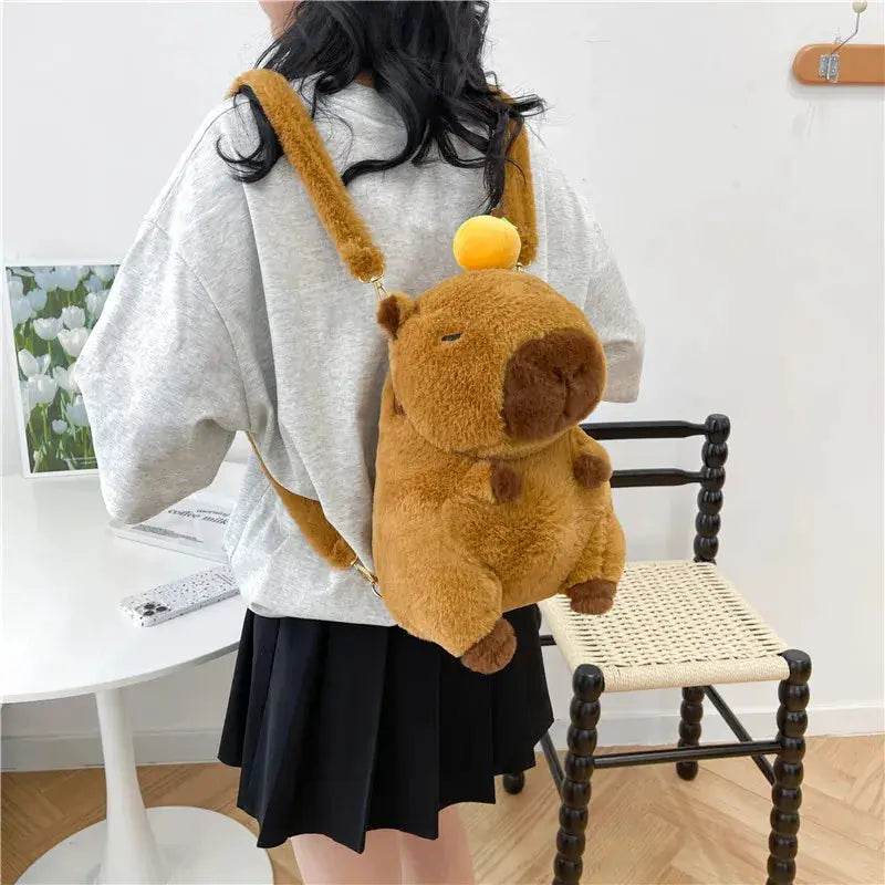 Cute plush capybara backpack crossbody bag in brown with yellow top pom, Simples Market