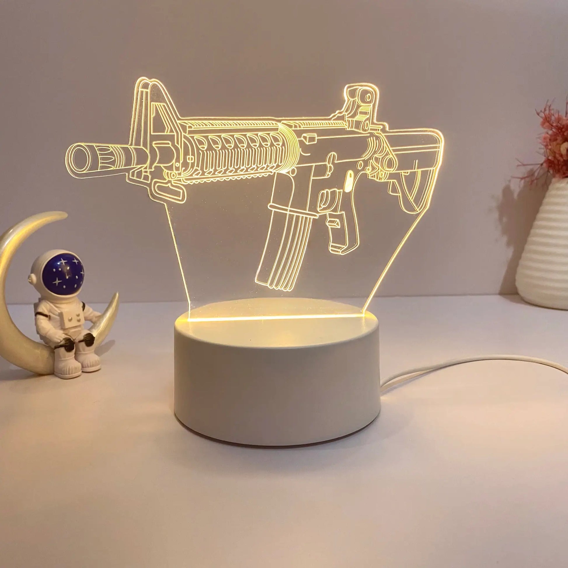 Submachine gun-shaped acrylic night light, USB-powered warm-white LED desk lamp.